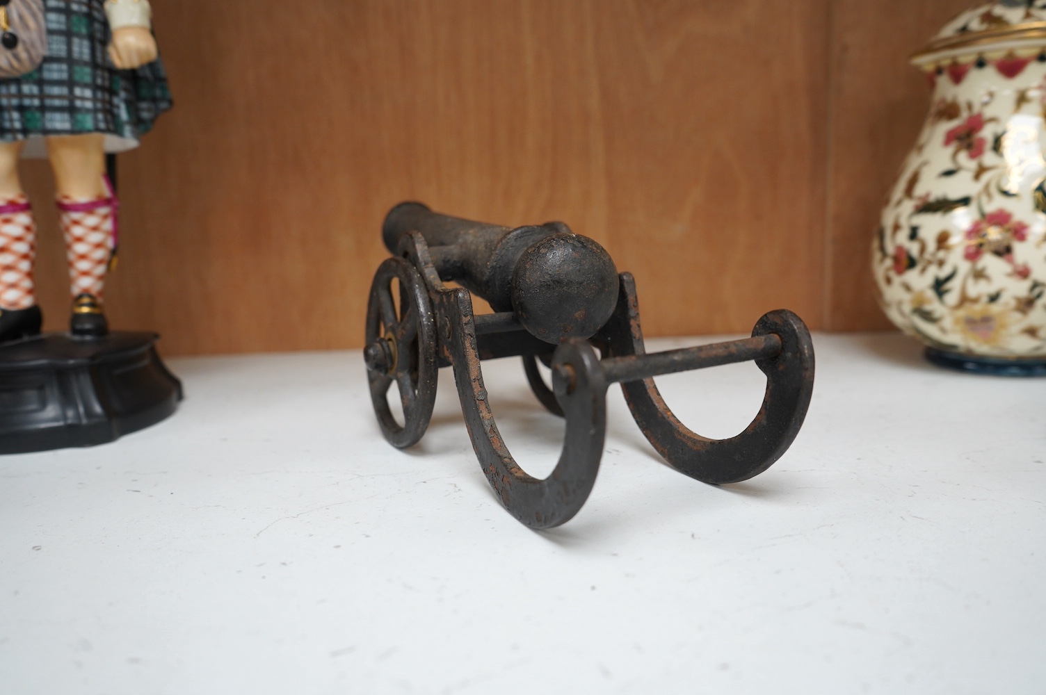 A miniature cast iron table canon, 19cm in length. Condition - fair